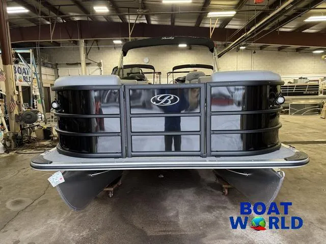 Slide: The Image of 2025 Bentley Pontoons Legacy 200 Navigator Quad Lounge in a showroom. - 31