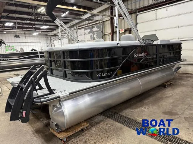 Slide: The Image of 2025 Bentley Pontoons Legacy 200 Navigator Quad Lounge in a warehouse setting. - 42