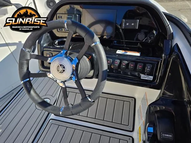 Slide: The Image of 2025 Yamaha Boats 195S steering console with controls and logo, showcased by Sunrise Marine. - 12