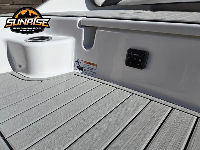 Slide: The Image of 2025 Yamaha Boats 195S, sleek black and blue design, side view. - 3