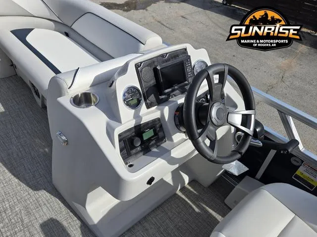 Slide: The Image of 2025 Avalon 21' Venture 85 Platinum Rear Fish boat dashboard with steering wheel and controls. - 9