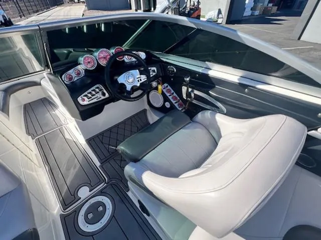 Slide: The Image of 2006 MasterCraft X45 boat interior with modern dashboard and comfortable seating. - 11