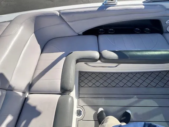 Slide: The Image of 2006 MasterCraft X45 boat interior with gray seating and cup holders. - 13