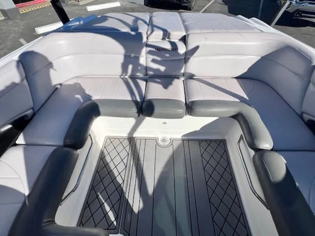 Slide: The Image of 2006 MasterCraft X45 boat interior with cushioned seating and sleek design. - 15