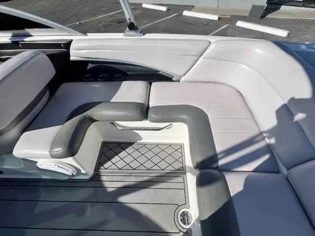 Slide: The Image of 2006 MasterCraft X45 boat interior with gray and white seating. - 16