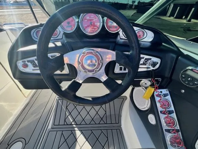 Slide: The Image of 2006 MasterCraft X45 boat dashboard with steering wheel and gauges. - 20