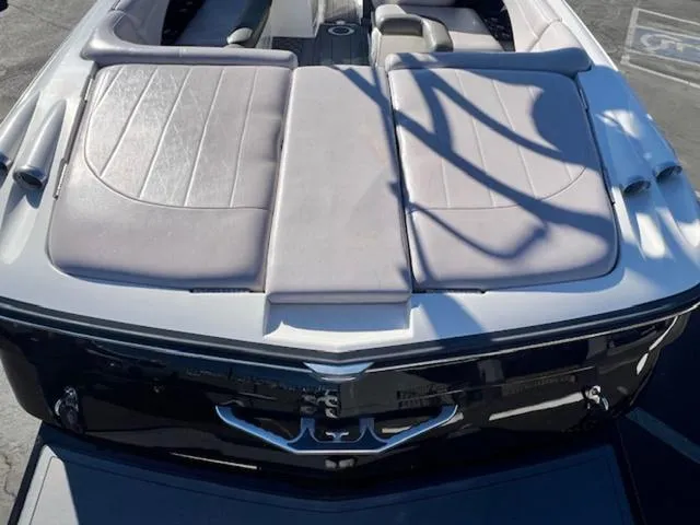 Slide: The Image of 2006 MasterCraft X45 boat with cushioned seating and sleek design. - 9