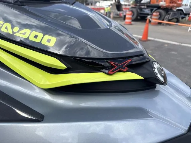 Slide: The Image of 2025 Sea-Doo Waverunner PWC RXT X 325, sleek design with vibrant yellow accents. - 12