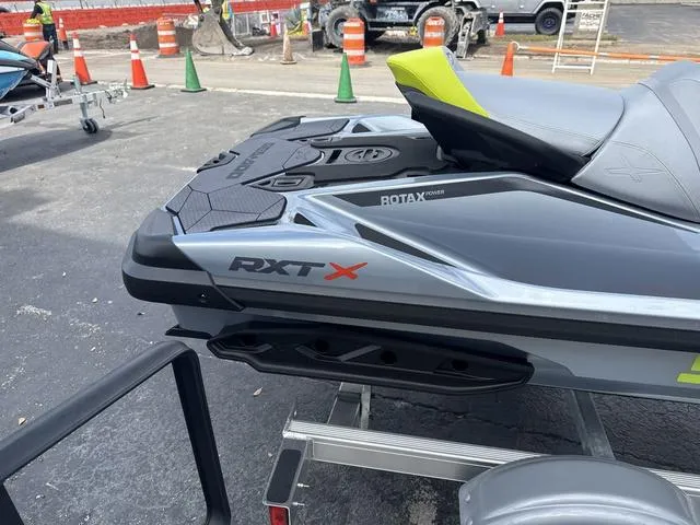 Slide: The Image of 2025 Sea-Doo Waverunner PWC RXT X on trailer, gray with yellow accents. - 9