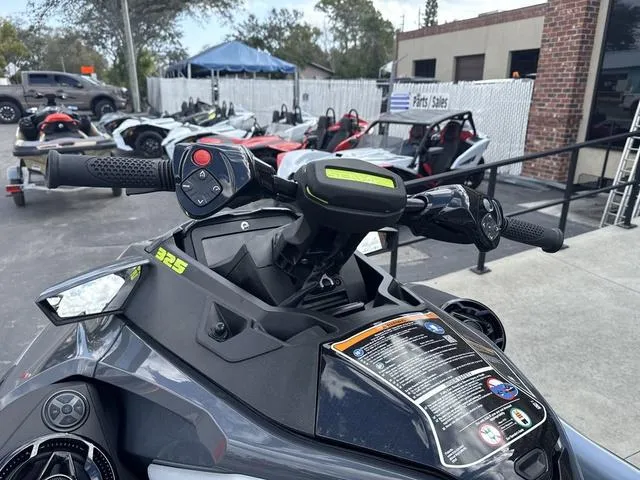 Slide: The Image of 2025 Sea-Doo Waverunner PWC RXT X 325 in a dealership lot. - 7