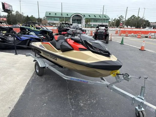 Slide: The Image of 2025 Sea-Doo Waverunner PWC RXP X 325 on trailer, parked outdoors. - 12