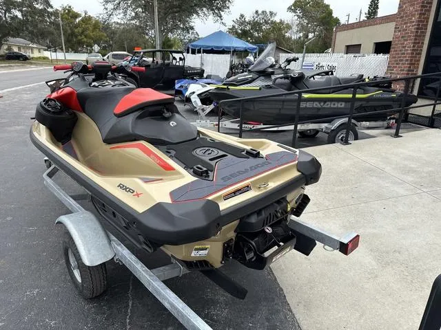 Slide: The Image of 2025 Sea-Doo Waverunner PWC RXP X 325 on trailer, parked outdoors. - 7