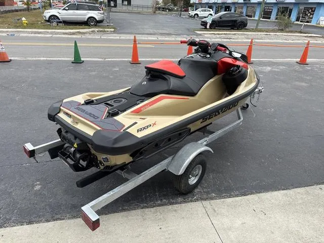 Slide: The Image of 2025 Sea-Doo Waverunner PWC RXP X 325 on trailer, parked outdoors. - 8