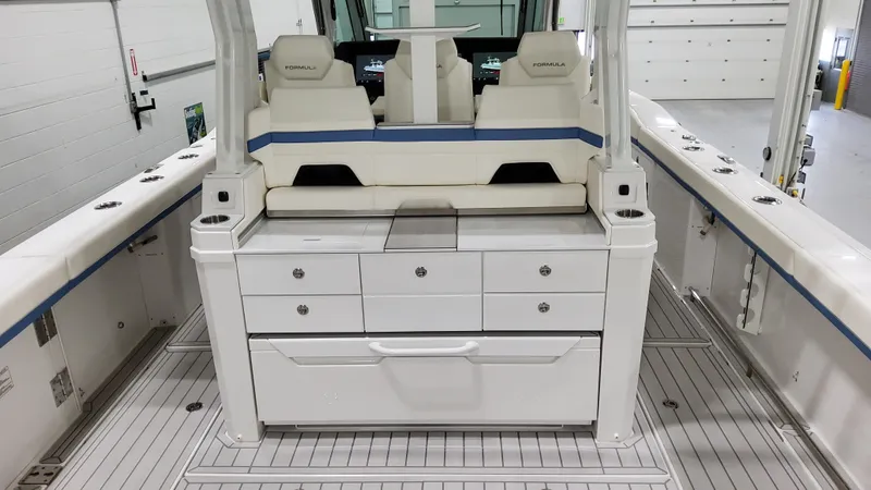 Slide: The Image of 2025 Formula 387 Center Console Fish boat interior with seating and storage. - 13