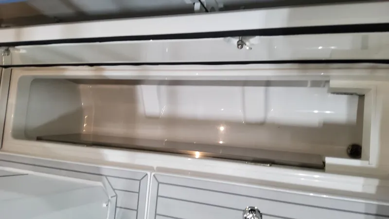 Slide: The Image of 2025 Formula 387 Center Console Fish storage compartment, sleek design, white finish. - 17