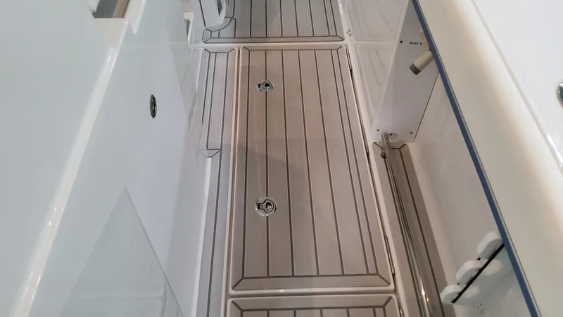 Slide: The Image of 2025 Formula 387 Center Console Fish boat deck, featuring sleek, modern design. - 18