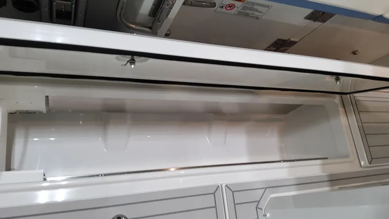 Slide: The Image of 2025 Formula 387 Center Console Fish boat storage compartment, open and empty. - 23