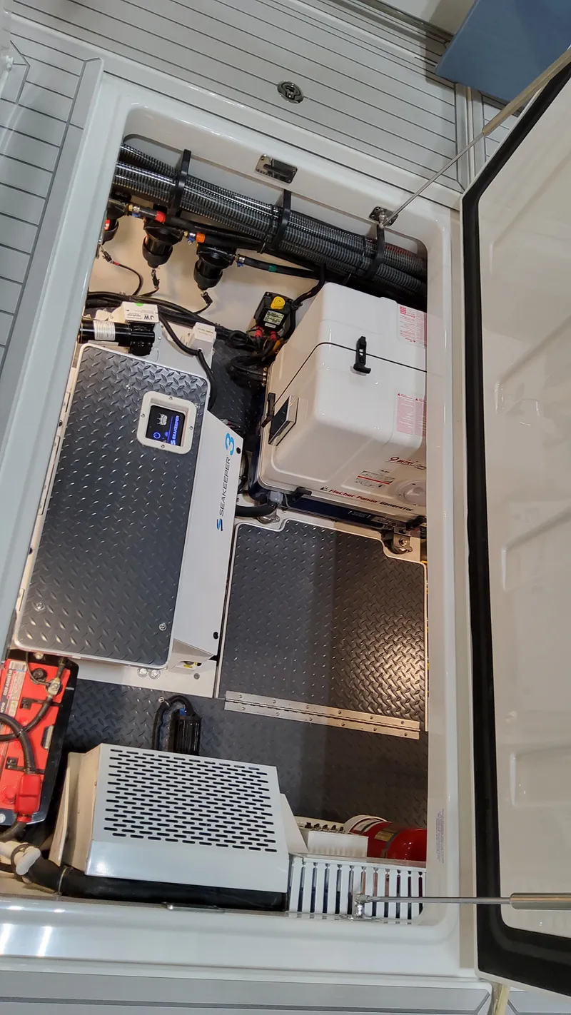 Slide: The Image of 2025 Formula 387 Center Console Fish engine compartment with advanced equipment and wiring. - 29