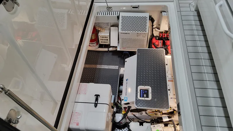 Slide: The Image of Engine compartment of 2025 Formula 387 Center Console Fish boat, showcasing equipment and storage. - 30