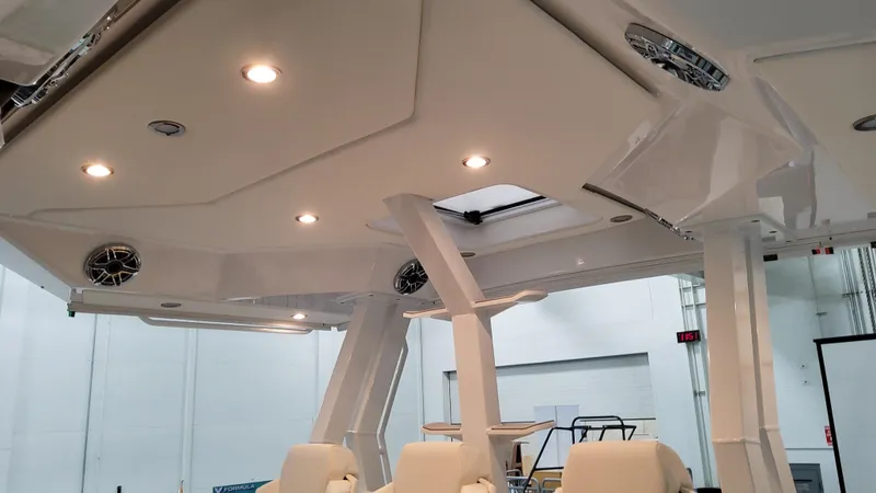 Slide: The Image of 2025 Formula 387 Center Console Fish boat interior with modern lighting and seating. - 35