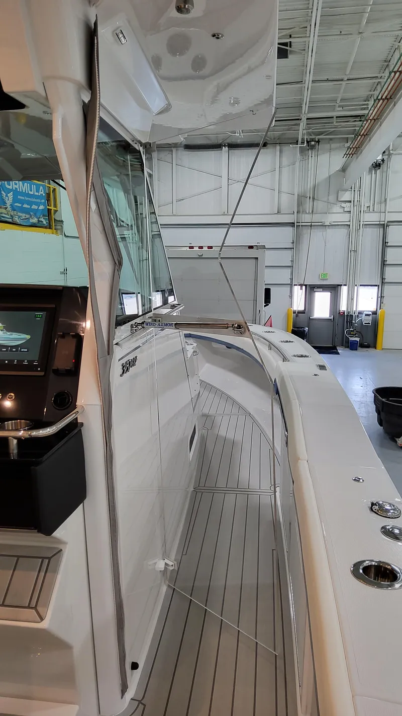 Slide: The Image of 2025 Formula 387 Center Console Fish boat in a spacious indoor facility. - 39