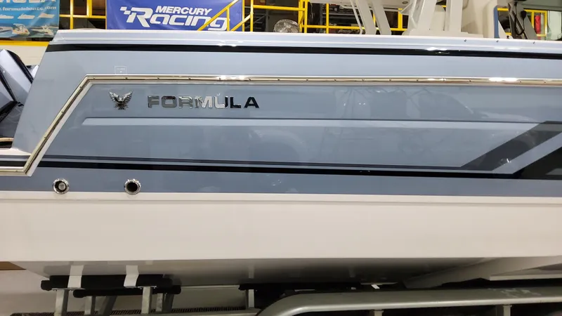 Slide: The Image of 2025 Formula 387 Center Console Fish boat with sleek design and Mercury Racing logo. - 4