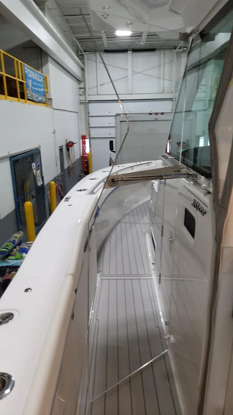 Slide: The Image of 2025 Formula 387 Center Console Fish boat in indoor storage facility. - 40