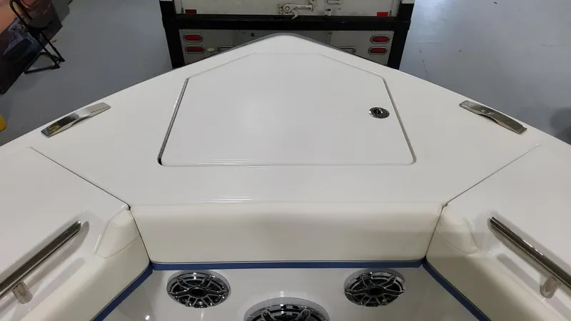 Slide: The Image of 2025 Formula 387 Center Console Fish boat deck with storage hatch and speakers. - 47