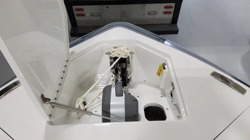 Slide: The Image of 2025 Formula 387 Center Console Fish anchor compartment, open lid, ropes visible. - 48