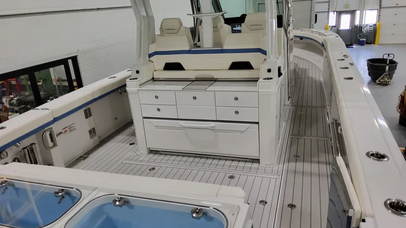 Slide: The Image of 2025 Formula 387 Center Console Fish boat interior with seating and storage. - 7