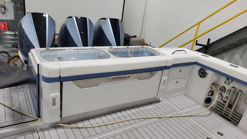 Slide: The Image of 2025 Formula 387 Center Console Fish boat with triple engines, sleek design. - 9