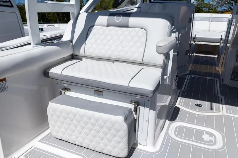 Slide: The Image of 2025 Sea Fox 288 Traveler boat interior with white cushioned seating and modern design. - 10