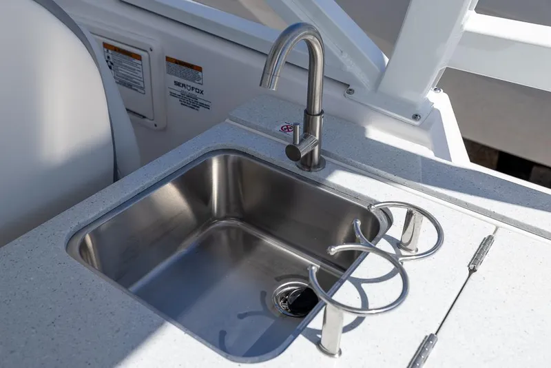 Slide: The Image of Stainless steel sink on 2025 Sea Fox 288 Traveler boat with modern faucet and cup holders. - 14
