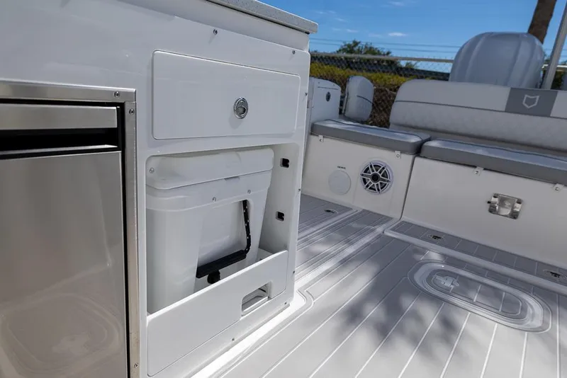 Slide: The Image of 2025 Sea Fox 288 Traveler interior with seating, storage, and marine speaker. - 16
