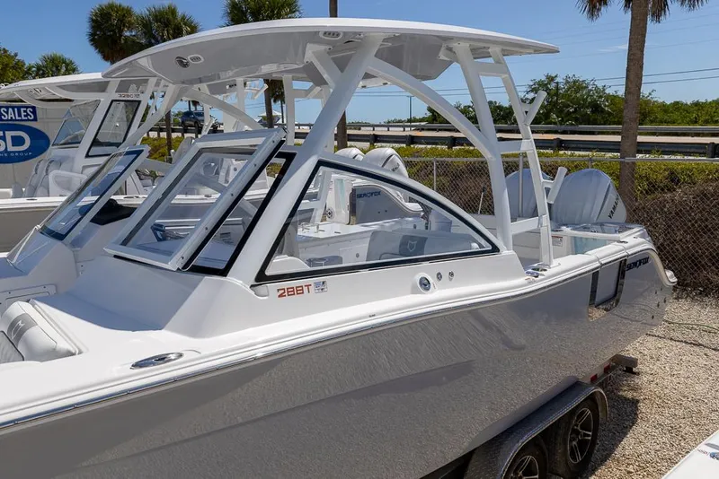 Slide: The Image of 2025 Sea Fox 288 Traveler boat displayed outdoors on a trailer. - 2