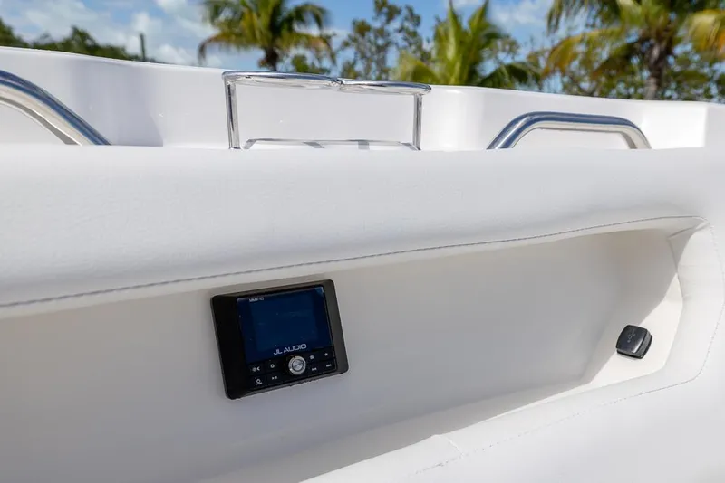 Slide: The Image of 2025 Sea Fox 288 Traveler boat interior with audio system, tropical background. - 26