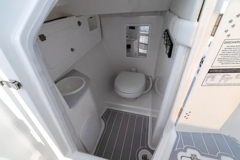 Slide: The Image of 2025 Sea Fox 288 Traveler boat bathroom with toilet and sink. - 29