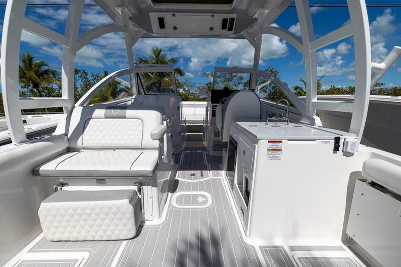 Slide: The Image of 2025 Sea Fox 288 Traveler boat interior with white seating and modern amenities. - 8