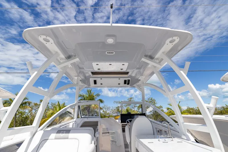 Slide: The Image of 2025 Sea Fox 288 Traveler boat interior with modern design and clear blue sky. - 9