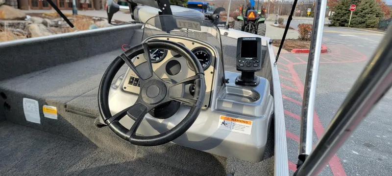 Slide: The Image of Steering console of a 2017 Lowe Stryker 17 boat with navigation equipment. - 3