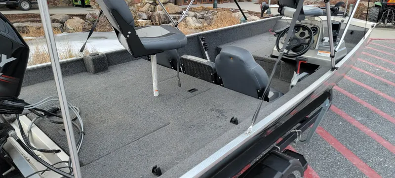 Slide: The Image of 2017 Lowe Stryker 17 fishing boat interior with seating and steering console. - 5