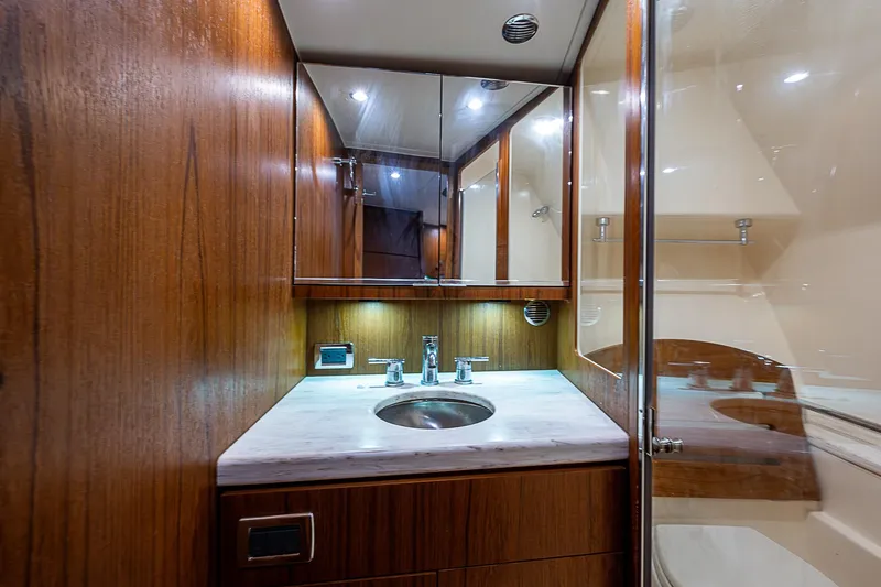Slide: The Image of Luxurious bathroom interior of 2013 Tiara Yachts 3600 Open with wood cabinetry and modern fixtures. - 14