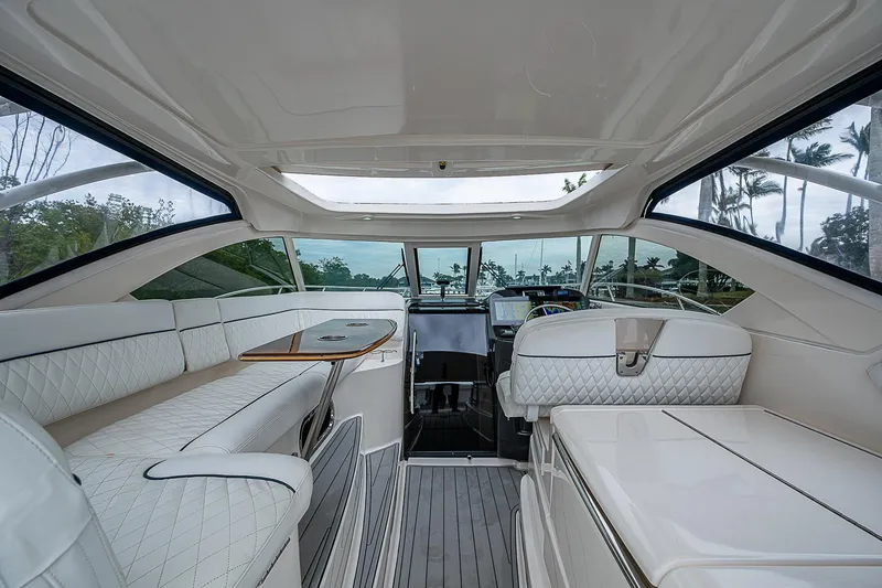 Slide: The Image of 2013 Tiara Yachts 3600 Open interior with luxurious seating and modern helm. - 17