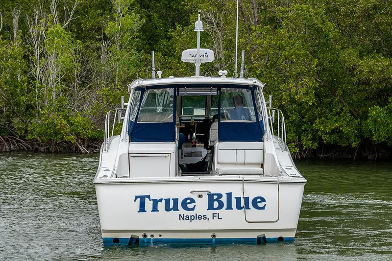 Slide: The Image of 2013 Tiara Yachts 3600 Open boat named "True Blue" in Naples, FL waters. - 4