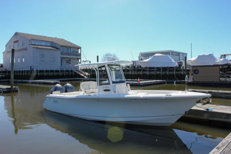 Slide: The Image of 2023 Sea Hunt Gamefish 27 with Coffin Box docked in a marina. - 12