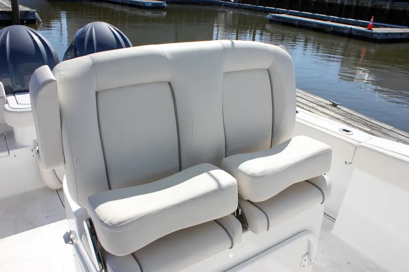 Slide: The Image of 2023 Sea Hunt Gamefish 27 boat seating with comfortable white cushions. - 16