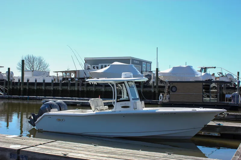 Slide: The Image of 2023 Sea Hunt Gamefish 27 with Coffin Box docked at marina. - 3