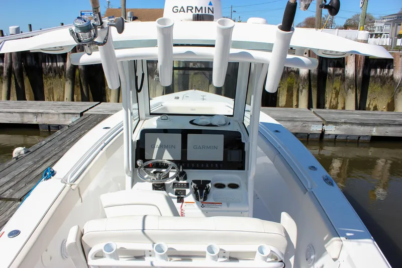 Slide: The Image of 2023 Sea Hunt Gamefish 27 with Coffin Box, featuring Garmin electronics and rod holders. - 5