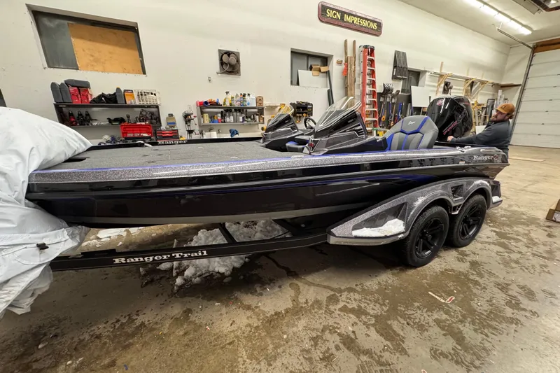 Slide: The Image of 2025 Ranger Z520 boat in a garage, on a Ranger Trail trailer. - 86