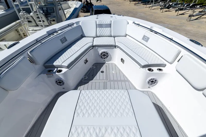 Slide: The Image of 2025 Sea Fox 328 Commander boat interior with cushioned seating and speakers. - 19